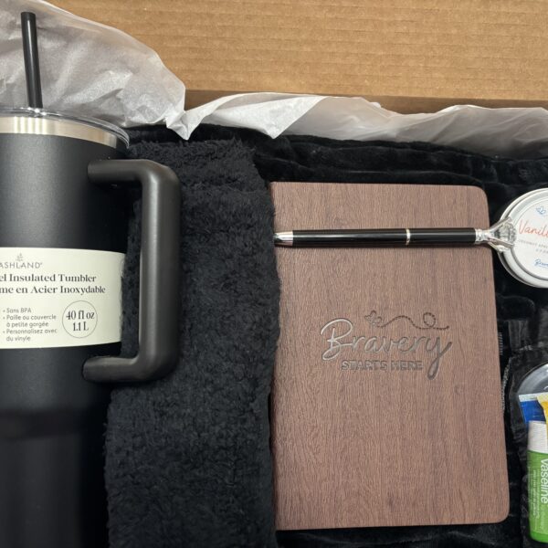 Black care package contents shown in box.