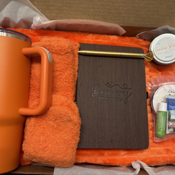 Tangerine care package contents shown in box.